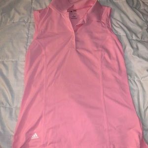 a pink adidas golf shirt